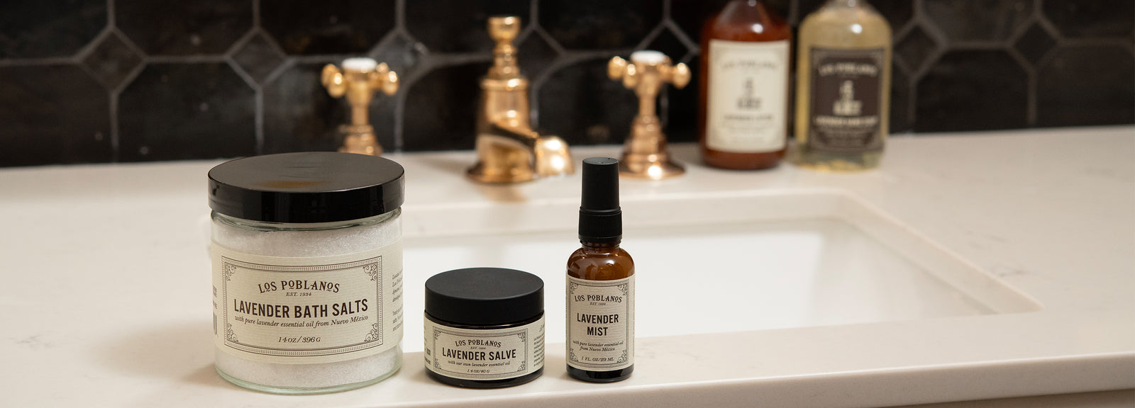 Bathroom setting with various skincare and bath products on a sink.