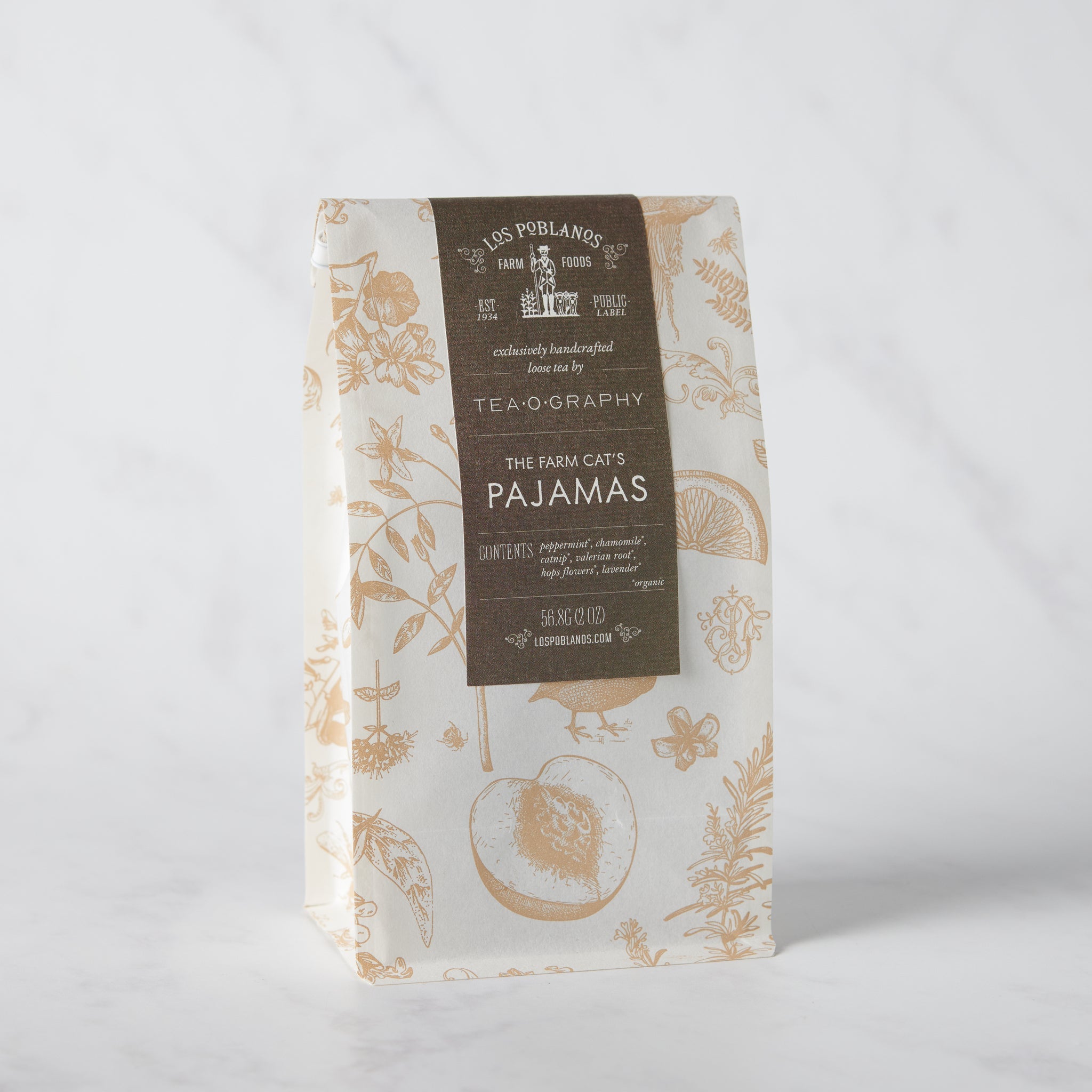 Tea package with floral design and brown label on a white background