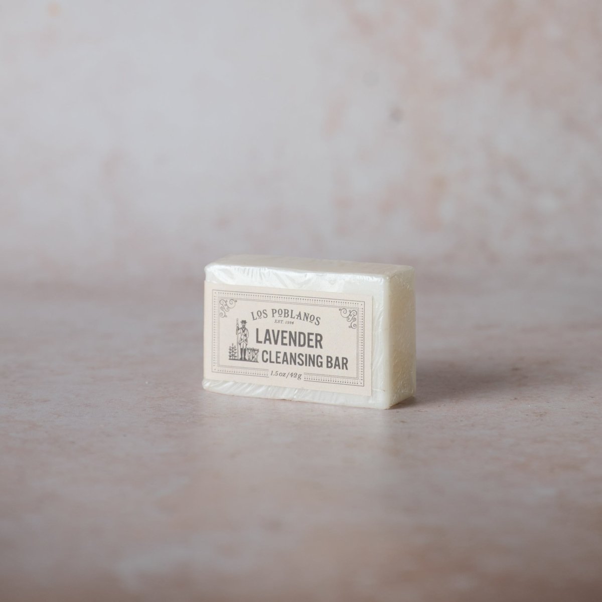 Bar of lavender cleansing soap on a marble surface | Lavender Cleansing Bar | Los Poblanos Online Shop