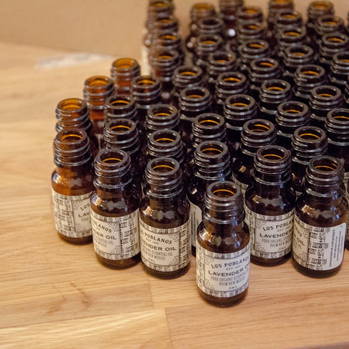small bottles on a wooden surface