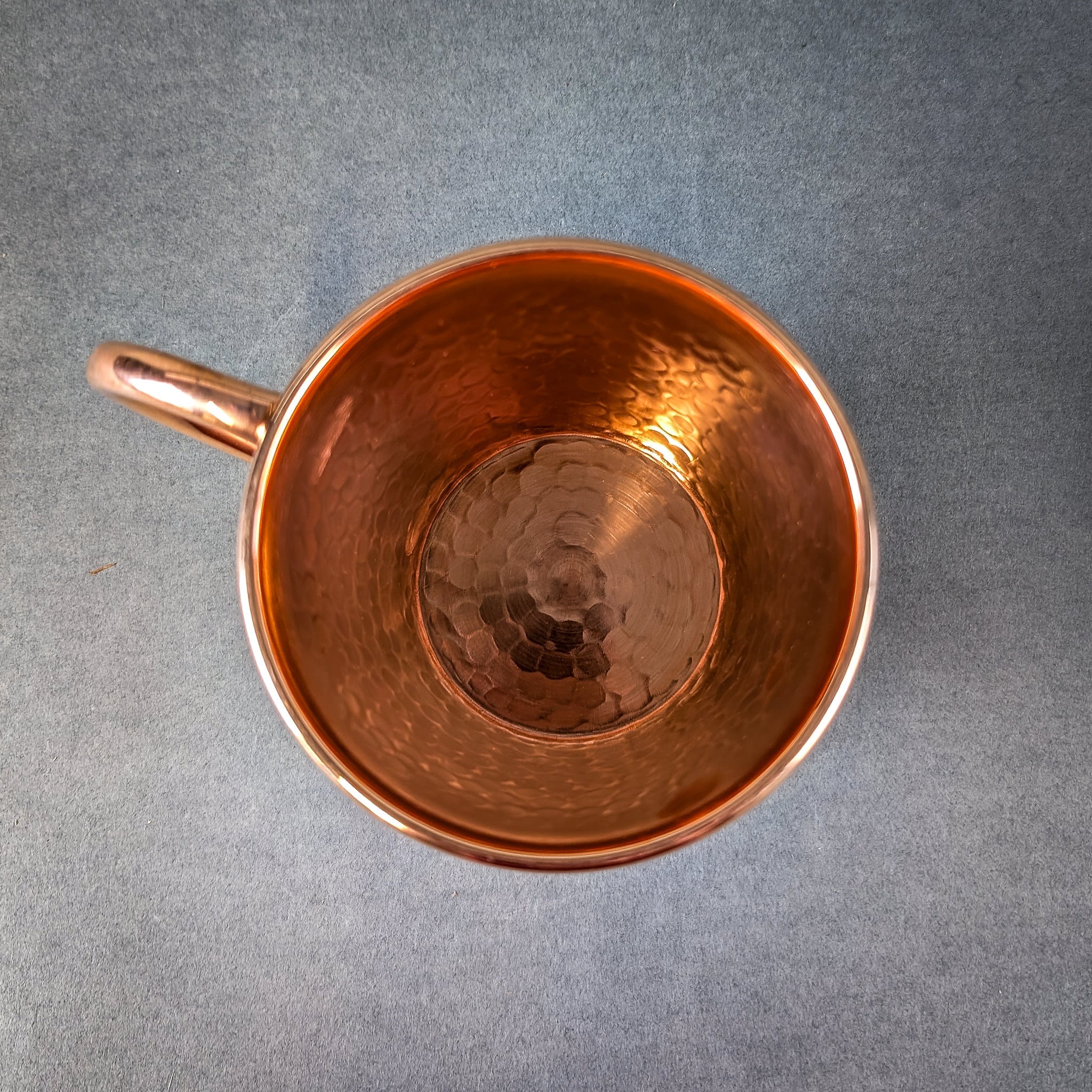 Copper mug on a gray background