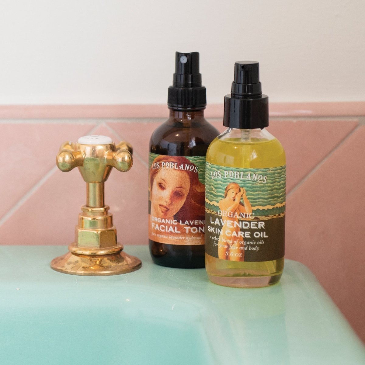 Facial Toner and Skin Care Oil on a mint green sink with pink tile