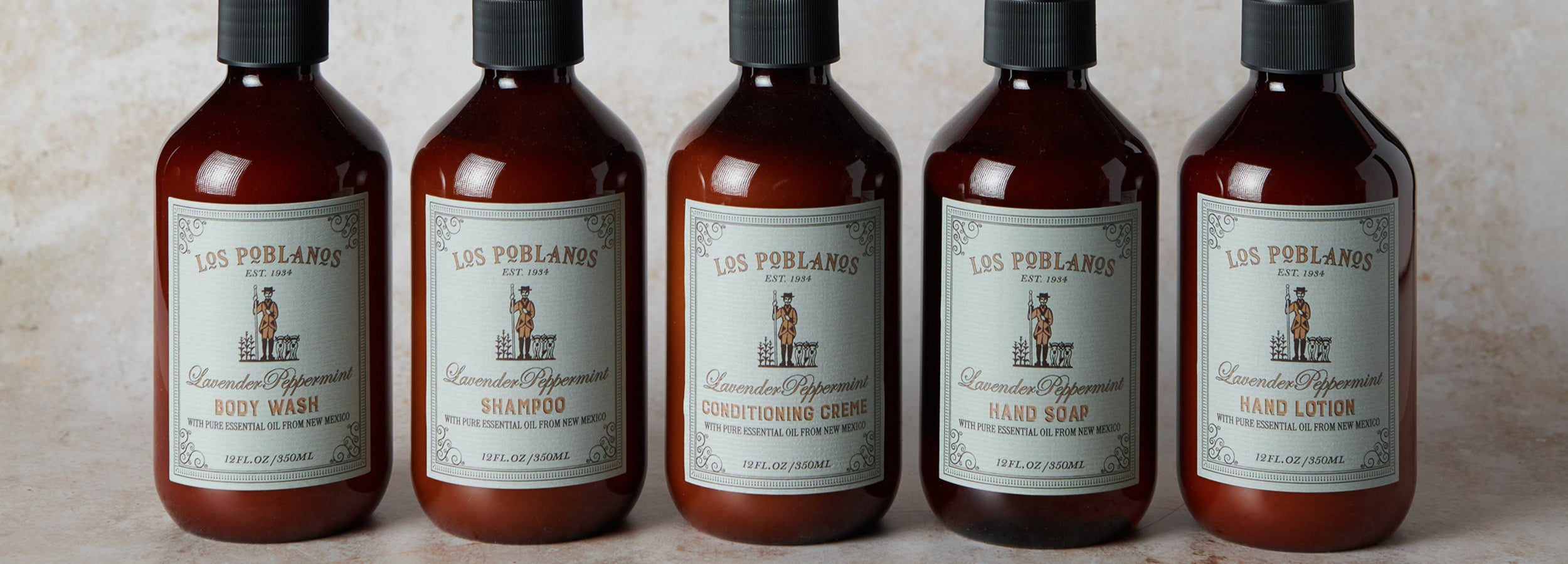 amber bottles in a row on a beige background