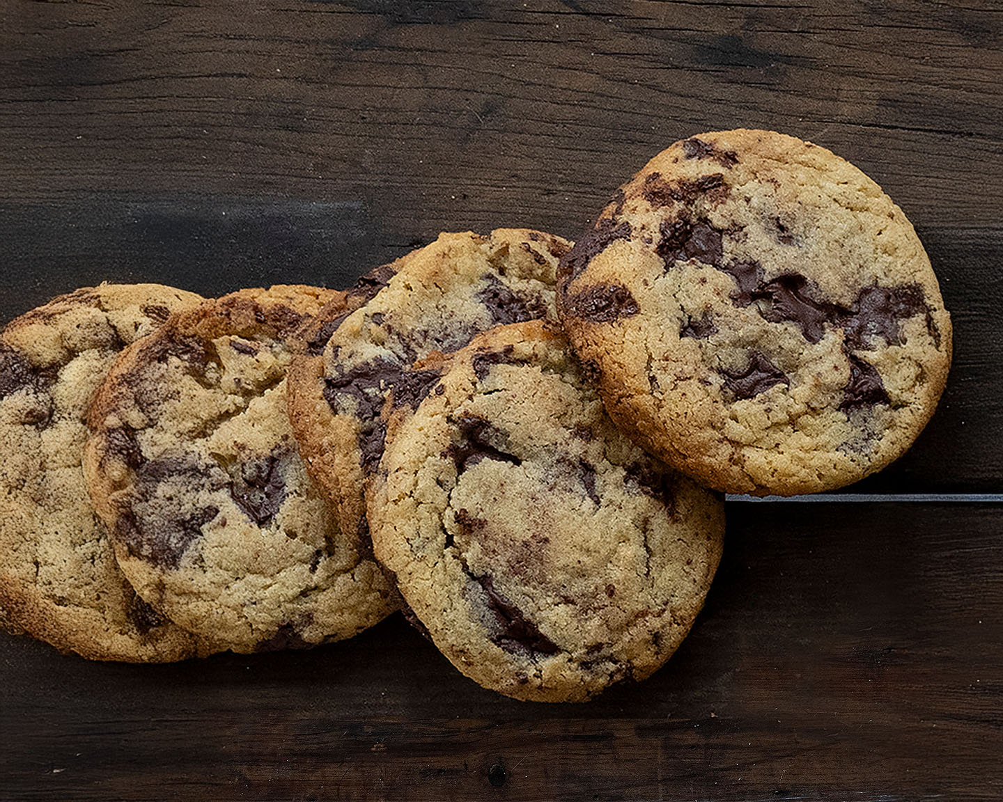 Chocolate chip cookies on a wooden surface