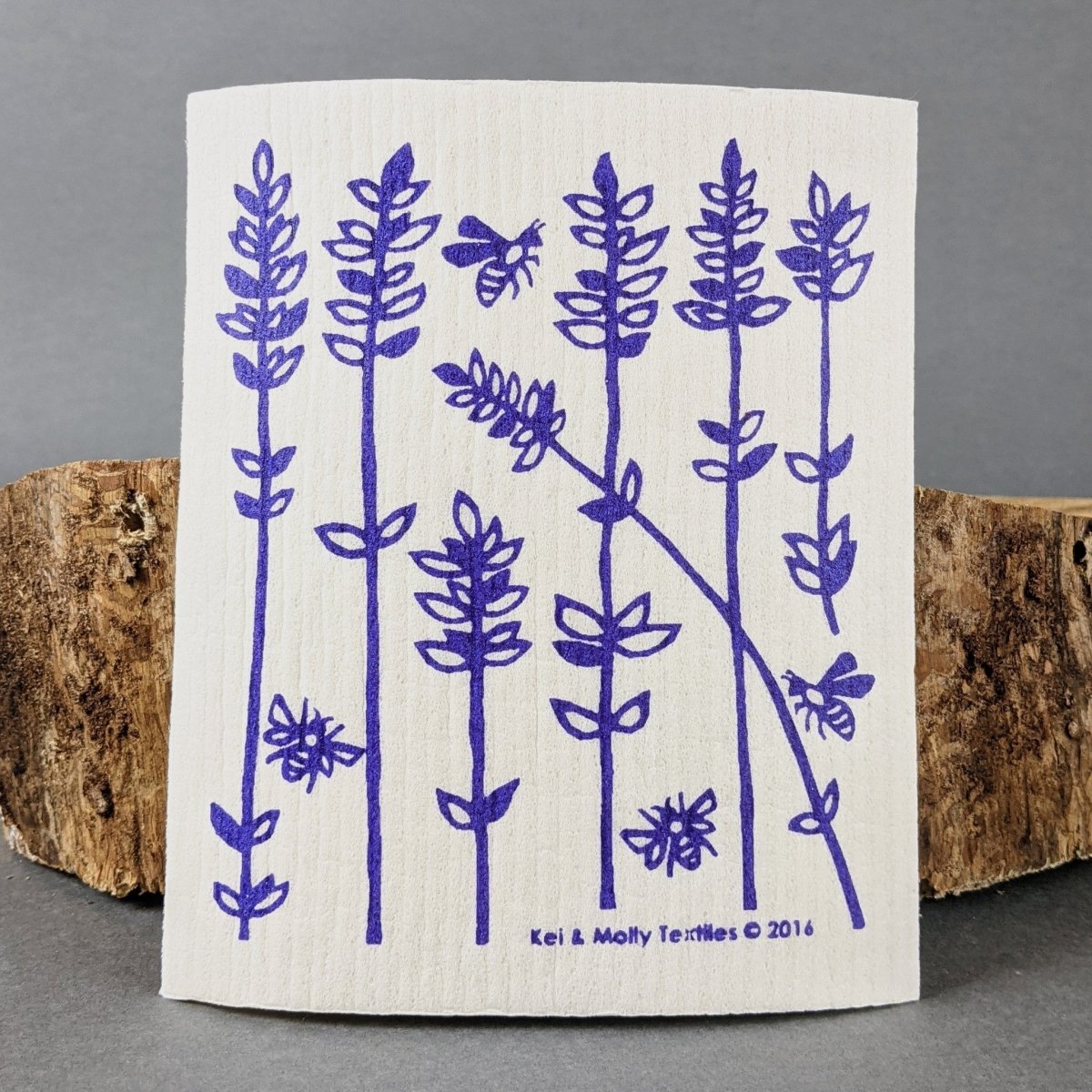 White cloth with blue floral pattern on a gray background