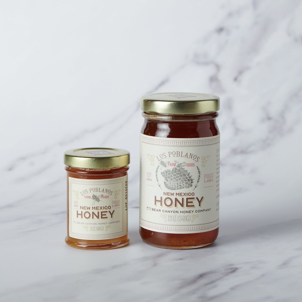 new mexico honey in glass jar on marble back ground